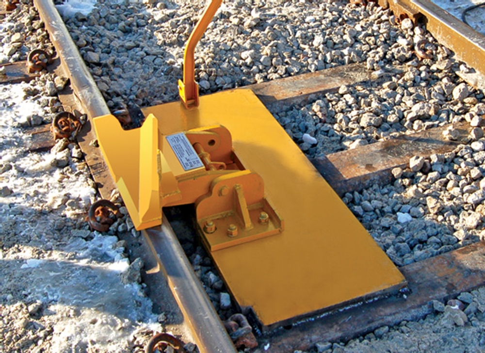 Weld Base Plate to 3 steel ties to provide foundation for bolting one-way or two-way hinged derail. No alteration of track is necessary. Base plate is designed to accommodate Pandrol clips. (Derail is not included with base plate, order separately.)